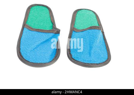 Slippers made of felt have a blue-green color. Isolated over white background. Close-up. Stock Photo