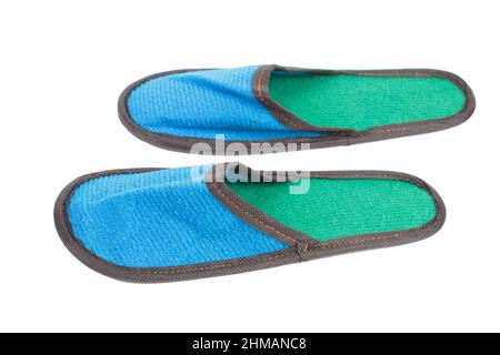 Slippers made of felt have a blue-green color. Isolated over white background. Close-up. Stock Photo