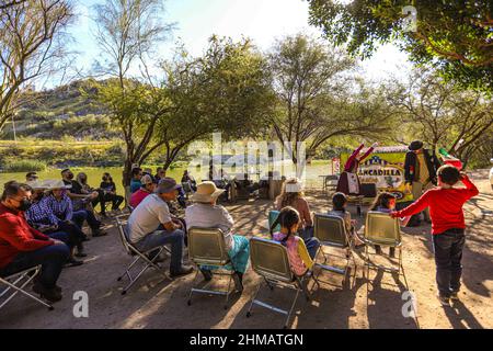 Members of the theater play Odisea Rodante de Zancadilla Treatro interact with children and adults next to the Sauceda Park wetland,Integrantes de la obra de teatro Odisea Rodante de Zancadilla Treatro interactúa con niños y adultos junto al humedal del Parque Sauceda, during World Wetlands Day to promote the care and conservation of the biodiversity of ecosystems on February 5, 2022 in Hermosillo, Mexico. (Photo by Luis Gutierrez Norte Photo/) Stock Photo