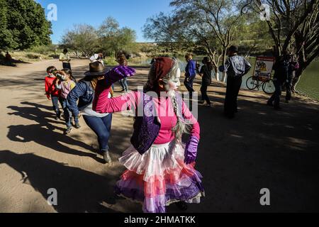 Members of the theater play Odisea Rodante de Zancadilla Treatro interact with children and adults next to the Sauceda Park wetland,Integrantes de la obra de teatro Odisea Rodante de Zancadilla Treatro interactúa con niños y adultos junto al humedal del Parque Sauceda, during World Wetlands Day to promote the care and conservation of the biodiversity of ecosystems on February 5, 2022 in Hermosillo, Mexico. (Photo by Luis Gutierrez Norte Photo/) Stock Photo