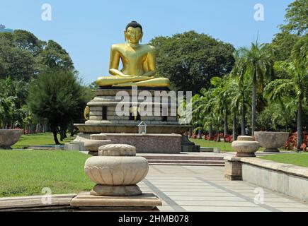Golden Buddha at Viharamahadevi Park in Sri Lanka Stock Photo