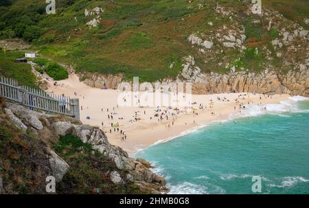 Porthcurno, UK, 2018: View of Porthcurno beach in Cornwall from the South West Coast Path. Stock Photo