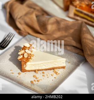 Sliced Cheesecake. Layer of biscuits, mousse based on creamcheese, with raspberry. Healthy dessert. Stock Photo