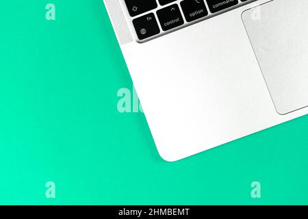 Laptop flat lay bright background. Office workspace table, minimal design concept. Top view, copy space Stock Photo