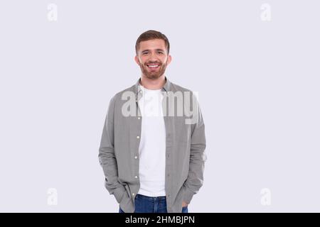 Man Standing Isolated Smilling Hands in Pockets Stock Photo