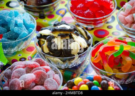 A yummy display of sweets show chewy and gooey candies from gummy to chocolates and all full of sugar Stock Photo