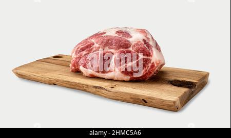 Raw pork on cutting board. Raw meat. Raw pork meat - neck or belly. Fresh meat and ingredients. Piece of fresh red meat on Butchery, market. isolated Stock Photo