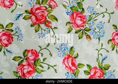Beautiful Rose flower with leaves design on light blue backdrop and Floral pattern design wallpaper for gift wrapping Stock Photo
