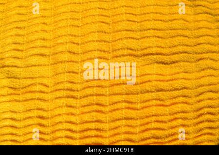 Beautiful Yellow cloth fabric background. Bright Yellow color vertical lined soft fabric textile background Stock Photo