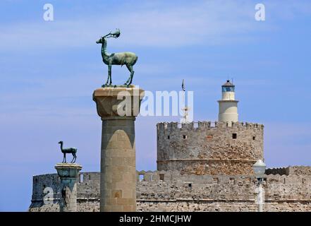 Mandraki harbour and fortress Agios Nicolaos,Rhodos city, Rhodos island, Greece Stock Photo