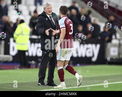 London, England, 8th February 2022. Roy Hodgson, Manager of Watford and Aaron Cresswell of West Ham United shake hands after the Premier League match at the London Stadium, London. Picture credit should read: Paul Terry / Sportimage Stock Photo