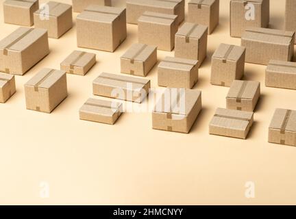 Lots of cardboard boxes pattern on brown background. Template Copy space for text. Stock Photo
