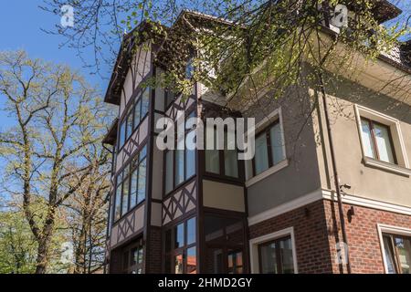 Zelenogradsk, Russia - may 12, 2021: modern building facade decorated as medieval one on sunny day Stock Photo