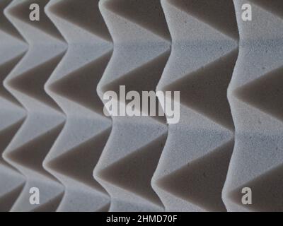 Pyramids of soundproof foam rubber, close-up. Sound-scattering material. Stock Photo