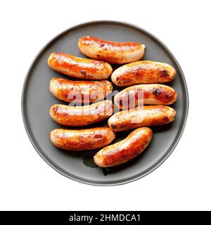 Fried sausage on isolated white background. Top view, flat lay Stock Photo