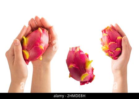 Sweet tasty dragon fruit or pitaya in woman hand isolated on white. Stock Photo