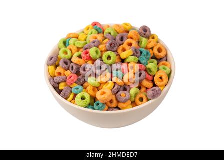 Colorful rings cereal spill out into a bowl. Breakfast. Isolated on a white background. Stock Photo