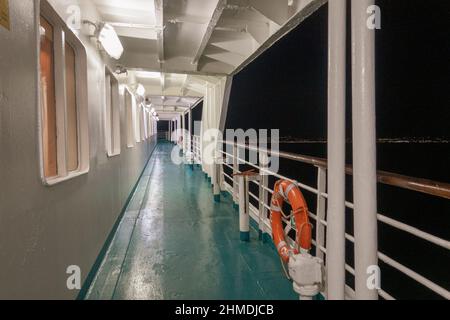 Illuminated deck of ship at night, Athens, Greece Stock Photo