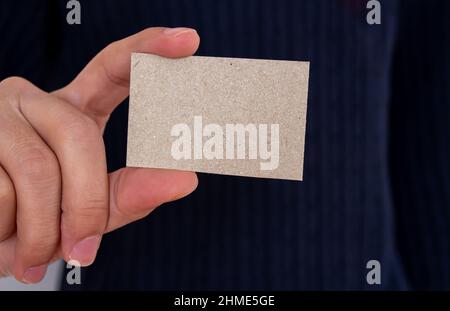 Businessman holding empty card, mockup business card template. Copy space for text. Close up. Stock Photo
