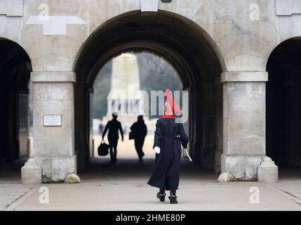 London, England, UK. Horse Guards, Whitehall. Member of the Household Cavalry - Blues and Royals -  marching through the main archway onto Horse Gua.. Stock Photo