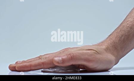 cropped view of man pressing plastic cup on grey, environmental concept Stock Photo