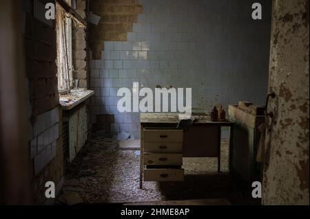The autopsy table in the abandoned morgue in Pripyat, Ukraine near the Chernobyl Nuclear Power Plant. Stock Photo