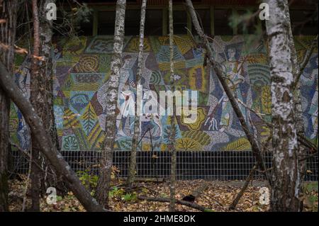 A detailed mosaic on an abandoned department store in Pripyat, Ukraine, near Chernobyl Nuclear Power Plant, has remained well preserved. Stock Photo