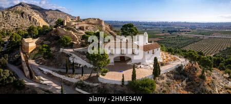 High angle panoramic view of Hermitage of La Magdalena and Old Castle ruins on top of the hill in Castello  Stock Photo