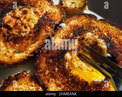 Egg in the basket, breakfast of eggs and toast Stock Photo