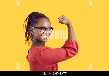 strong lady show arm muscles, sit in gym after training, happy woman in  sportswear look at her arm and smile Stock Photo - Alamy