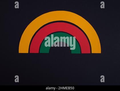 Black history month colors rainbow. Paper cut abstract composition on dark background. Stock Photo