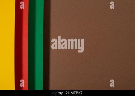 Black history month colors background. Red, green and yellow paper cut abstract composition. Stock Photo