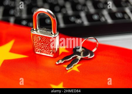 China cyber security concept. Padlock on computer keyboard and China flag. Close-up view Stock Photo