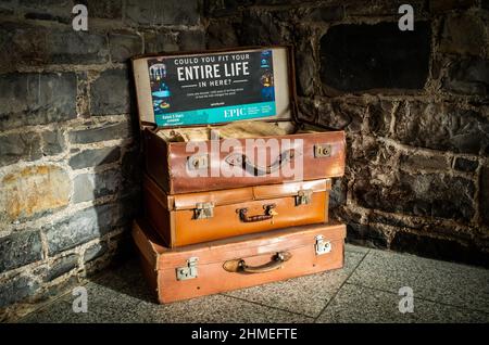 Empty vintage suitcases on display at EPIC, The Irish Emigration Museum in Dublin Ireland. 'Could you fit your entire life in here?' Stock Photo