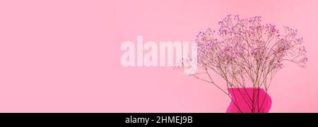Pink gentle flowers in vase on ad banner with copy space for text. Stock Photo