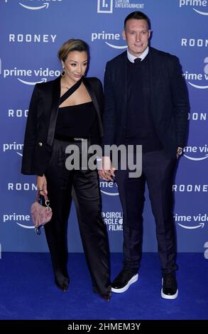 Manchester United's Phil Jones and wife kaya Hall arrive for the world premiere of Amazon Prime Video's Rooney at Home, 2 Tony Wilson Place, Manchester. Picture date: Wednesday February 9, 2022. Stock Photo