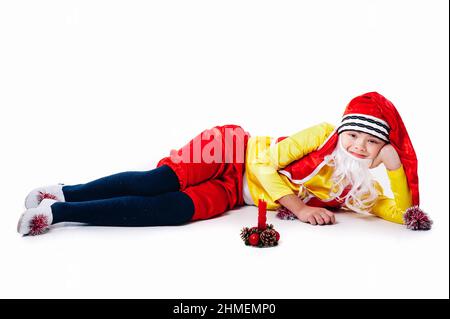 A baby dressed as a elf. isolated. Santa's helper. boy in suit of dwarf or elf Stock Photo