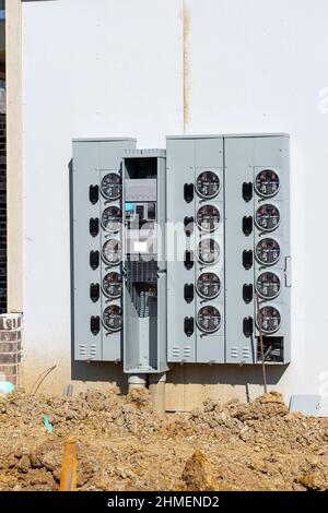 Vertical shot of an electric meter installation for new multi-family apartment construction. Stock Photo