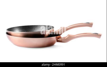 Copper frying pans on white background Stock Photo