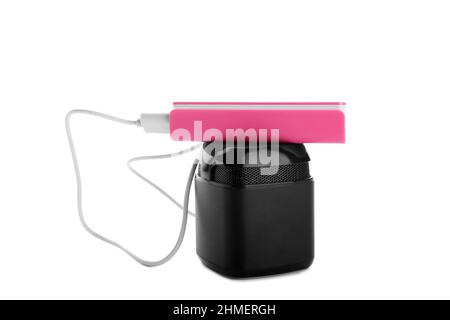 Pink power bank with speaker on white background Stock Photo