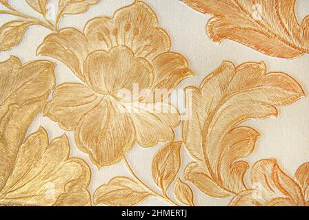 embroidered golden color flowers design macro bacgound Stock Photo
