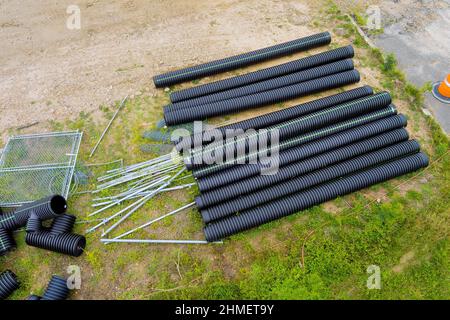 The drainage pipes system of laying underground utilities from black pipes of supply sewage Stock Photo