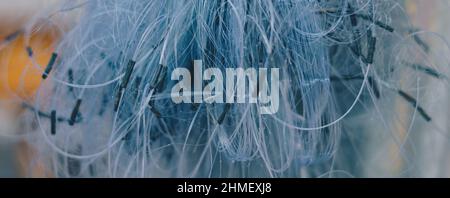 BANNER Abstract real photo white gray pale blue background. Close sail sea fishing tangled line airy mesh texture. Geometric waves circles threads Stock Photo