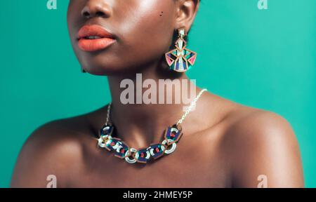 Fashion portrait of Black woman against green background Stock Photo