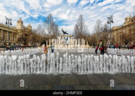 Visitors at the fountain in front of controversial monument to the victims of the German occupation, Freedom Square, Szabadsag ter, V. district Stock Photo