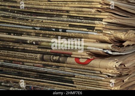A stack of old, yellowed newspapers Stock Photo