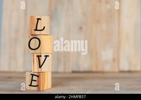 vertical wooden blocks with the word I love you, on a wooden background Stock Photo