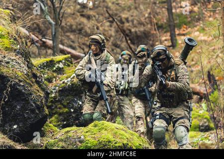 Mixed gender infantry marine squad on a infiltration mission Stock Photo