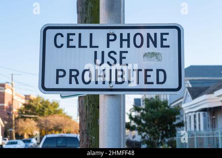 'Cell Phone Use Prohibited' sign in school zone in New Orleans, LA, USA Stock Photo