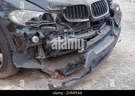Severely damaged front end of automobile following a collision on February 7, 2022 in New Orleans, LA, USA Stock Photo